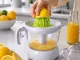 Elektriskā citrusaugļu sulu spiede 0.7L 25W, balta