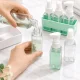 Ceļojumu pudeļu komplekts kosmētikai 4x50ml ar organizatoru un uzlīmēm