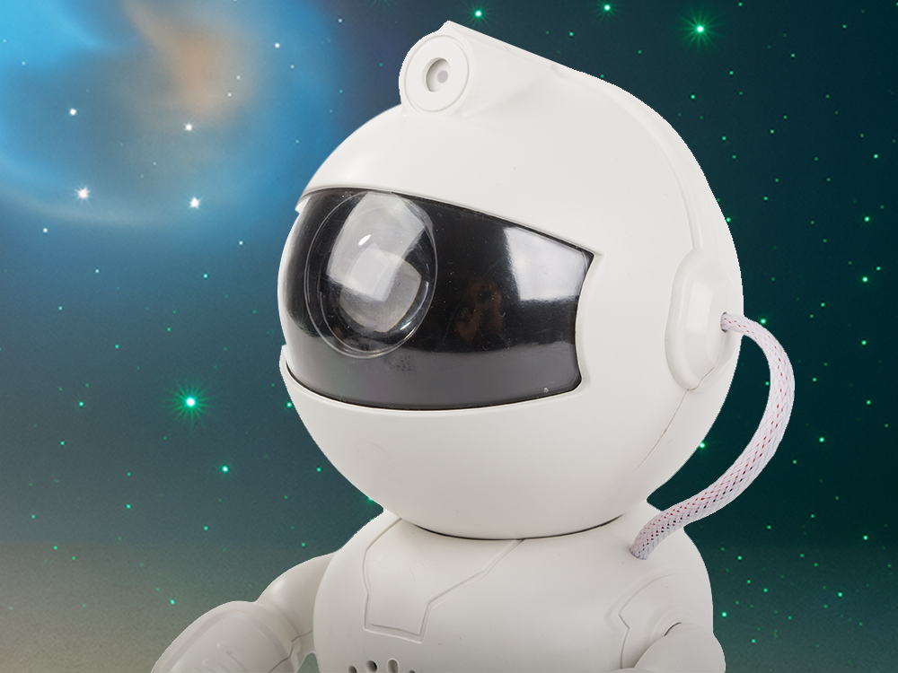 Kosmonauta zvaigžņu projektors un nakts lampiņa ar Bluetooth skaļruni